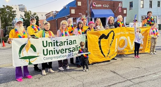 Pride parade 2023 carrying our Love banner