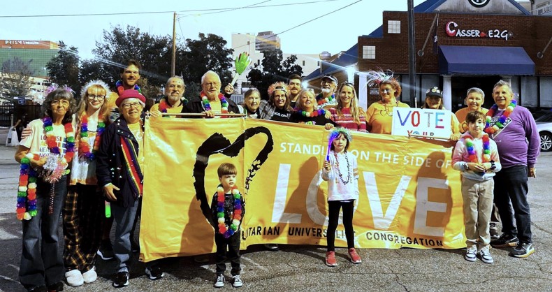 Pride parade 2023 carrying our Love banner